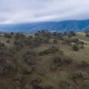 Clouds drift across peaceful green hills and valleys in the tri-valley area in Northern California Clouds drift across peaceful green hills and valleys in the tri-valley area in Northern California