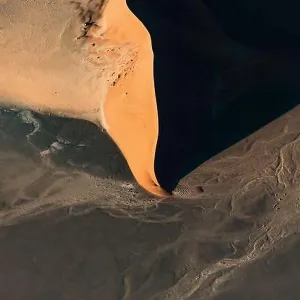 Contrasted abstract of the Oxide rich red sand dunes in the great sand sea of Namibia Contrasted abstract of the Oxide rich red sand dunes in the great sand sea of Namibia