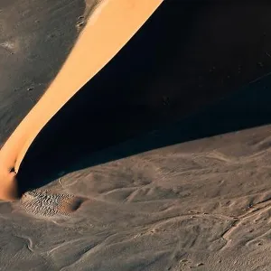 Contrasted abstract of the Oxide rich red sand dunes in the great sand sea of Namibia Contrasted abstract of the Oxide rich red sand dunes in the great sand sea of Namibia