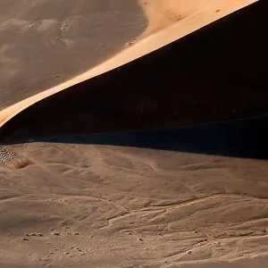 Contrasted abstract of the Oxide rich red sand dunes in the great sand sea of Namibia Contrasted abstract of the Oxide rich red sand dunes in the great sand sea of Namibia