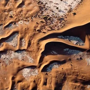 Contrasted abstract of the Oxide rich red sand dunes in the great sand sea of Namibia Contrasted abstract of the Oxide rich red sand dunes in the great sand sea of Namibia