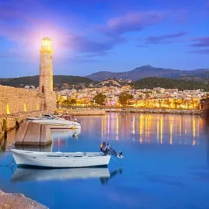 Crete Island - Lighthouse at Old Venetian Port, Rethymno, Greece Crete Island - Lighthouse at Old Venetian Port, Rethymno, Greece