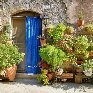 Entrance decorated with flowers, Pitigliano, Tuscany, Italy Entrance decorated with flowers, Pitigliano, Tuscany, Italy