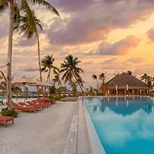 Fantastic panoramic poolside, sunset sky, palm trees. Luxury tropical beach landscape, infinity swimming pool, deck chairs beds under umbrellas