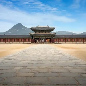 Gyeongbokgung palace gate and wall with nice sky in morning landmark of Seoul, South Korea. Asian tourism, history building, or tradition culture