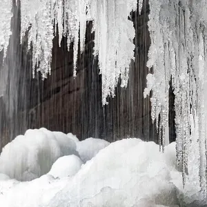 Icicles hanging from Slick Rock Falls in winter - Pisgah National Forest - near Brevard, North Carolina USA Icicles hanging from Slick Rock Falls in winter - Pisgah National Forest - near Brevard, North Carolina USA