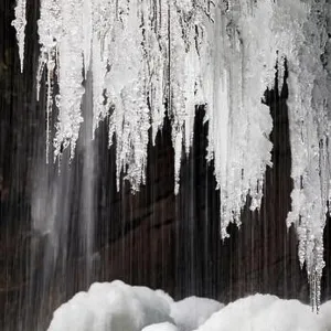 Icicles hanging from Slick Rock Falls in winter - Pisgah National Forest - near Brevard, North Carolina USA Icicles hanging from Slick Rock Falls in winter - Pisgah National Forest - near Brevard, North Carolina USA