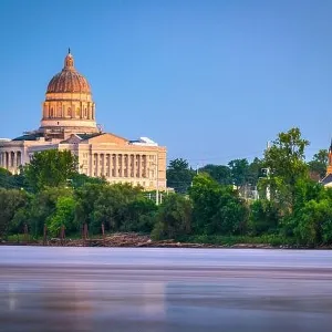 Jefferson City, Missouri, USA downtown view on the Missouri River with the State Capitol at dusk Jefferson City, Missouri, USA downtown view on the Missouri River with the State Capitol at dusk