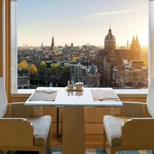 Modern luxury restaurant interior with romantic sence Amsterdam old town view in Amsterdam, Netherlands