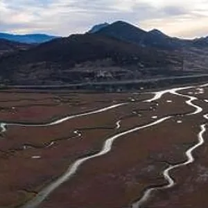 Narrow channels meander through a beautiful estuary in Central California. Estuaries form when freshwater runoff meets and mixes with seawater Narrow channels meander through a beautiful estuary in Central California. Estuaries form when freshwater runoff meets and mixes with seawater