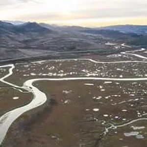 Narrow channels meander through a beautiful estuary in Central California. Estuaries form when freshwater runoff meets and mixes with seawater Narrow channels meander through a beautiful estuary in Central California. Estuaries form when freshwater runoff meets and mixes with seawater