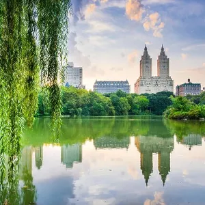 New York City, USA at the Central Park Lake and Upper West Side skyline New York City, USA at the Central Park Lake and Upper West Side skyline