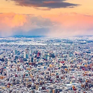 Sapporo, Japan winter skyline view from the mountains at dusk