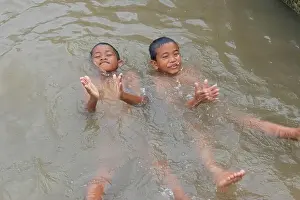 1 October, 2011 - Bangkok, Thailand:Boys playing in Chaopraya river