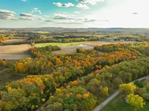 10-16-2022, Late afternoon aerial autumn image of the area surrounding the Village of Trumansburg, NY, USA