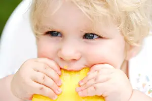Blue Eye Prints: 10 month old baby eating pineapple