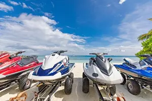 14.12.2019 - Ari atoll, Maldives: Jet skis on tropical beach coast, shore. Resort hotel scenery jet skis parked on the beach for tourist