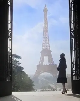Adults Prints: 1920s ANONYMOUS SILHOUETTED WOMAN STANDING IN PROFILE IN THE TROCADERO ACROSS THE SEINE FROM THE EIFFEL TOWER PARIS