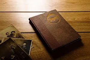 Hardback Prints: 1920's era photograph album on a polished wood surface
