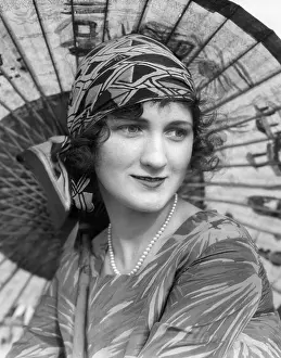 Hars Prints: 1920s PORTRAIT OF A WOMAN IN FRONT OF A JAPANESE PARASOL WEARING PEARLS AND A SILK PRINT HEADBAND