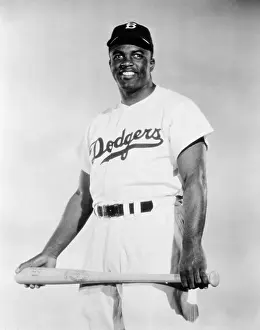 Physical Fitness Prints: 1940s 1947 BROOKLYN DODGERS BASEBALL PLAYER JACKIE ROBINSON WHO BROKE THE BASEBALL COLOR BARRIER STANDING LOOKING