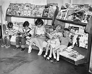 Hars Prints: 1950s GROUP OF 5 CHILDREN SITTING ON NEWSSTAND READING MAGAZINES COMIC BOOKS