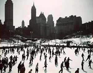Trending: 1950s LARGE NUMBER OF PEOPLE ICE SKATING ON WOLLMAN RINK CENTRAL PARK MANHATTAN NEW YORK CITY USA