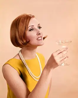 25 30 Years Prints: 1960s FASHIONABLE RED HEADED WOMAN TOASTING HOLDING GLASS OF CHAMPAGNE - kf4589 HAR001 HARS YOUNG ADULT WOMAN 1960s
