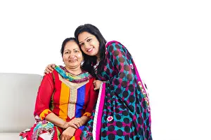 Saree Prints: 2 indian Adults Only Mother and daughter Sitting sofa