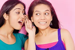 Sibling Prints: 2 indian Young Womans friends Whisper Talking