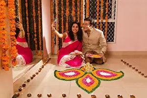 Saree Prints: 2 Married Couples Husband and wife Diwali Festivals Home Rangoli Decoration and Mobile phone Selfie Clicking Picture