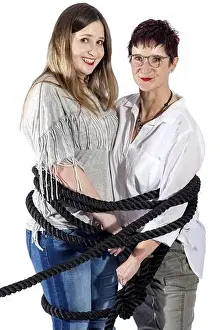 Single Person Prints: 2 smiling woman tied up with a black rope