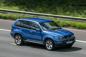 Expressway Prints: A 2005 BMW X5 Sport D Auto Blue Car SUV Diesel driving on the M6 motorway near Preston in Lancashire
