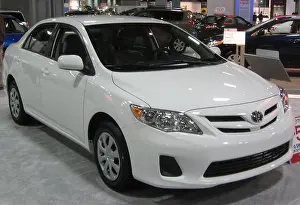 Reliable Prints: The 2011 Toyota Corolla LE is a compact sedan known for its reliability and excellent fuel efficiency