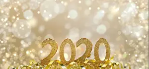 2020 golden figures in glitter and on blur light background