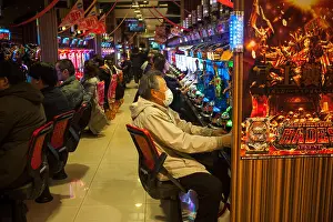 Kyoto Prints: 23.12.2017, Kyoto, Japan, Asia - Japanese people play with the Pachinko gaming machines in a parlour in Kyoto
