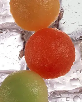 Scoop Prints: 3 scoops of different varieties of melon on ice