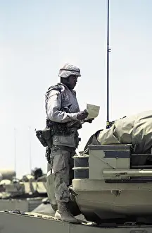 Armored Prints: 30th October 1993 A black U.S. Army soldier stands on top of his M1A1 Abrams tank of the 24th Infantry Division