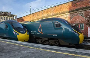 390136 with 390009 at Preston railway station. Saturday 09th April 2022