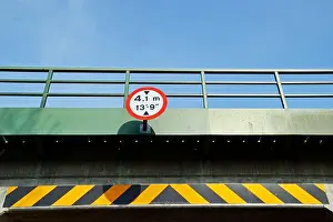 Railings Prints: 4.1m, 13 9' bridge height sign, with black and yellow warning stripe on rural tunnel