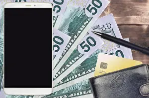 Quick Prints: 50 US dollars bills and smartphone with purse and credit card