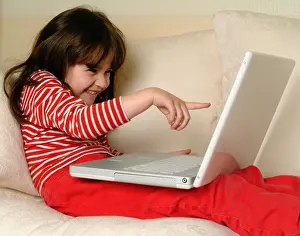 6 year old girl with a laptop computer