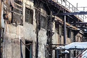 Yard Prints: abandoned broken factory workshop building in idle old Demidov metallurgical plant in Nizhny Tagil city