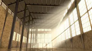 Rays Prints: An empty and abandoned factory interior in the daytime with bright early morning light rays streaming in the windows