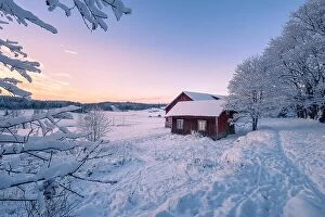 Images Dated 24th December 2018: Abandoned house with snowy landscape and sunset at winter evening in Finland