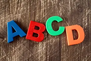 Magnetic Prints: ABCD spelling from plastic letters