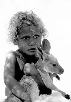 Kangaroo Prints: Aboriginal girl from the Western desert of Australia with baby pet kangaroo