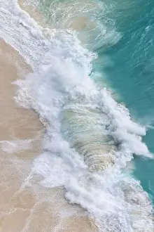 Bird View Prints: From above, turquoise waves gently crash onto the soft sands of Kelingking Beach in Nusa Penida
