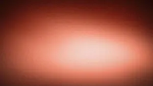Noise Prints: Abstract 4K background with grainy texture and soft blurred gradient in terracotta tones