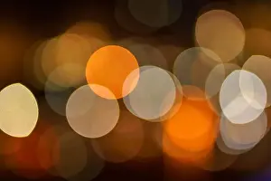 Sparks Prints: Abstract blurred blue, orange and yellow bokeh lights background